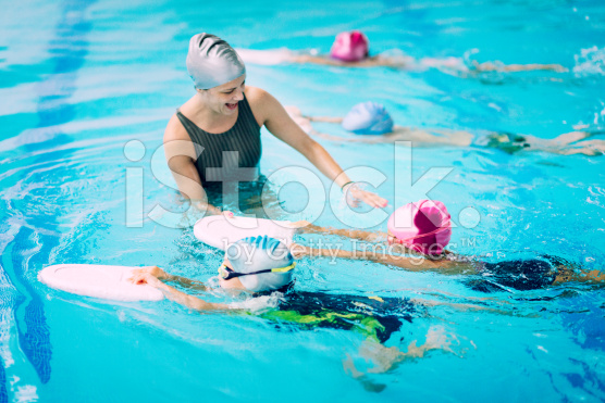 stock-photo-50788882-kids-having-a-race-in-swimming-class